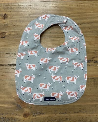 Spotty cow baby bib