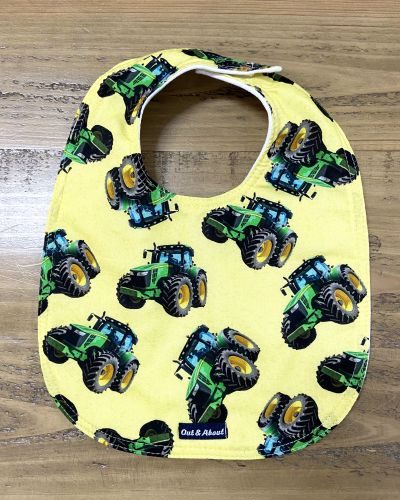 Yellow tractor baby bib