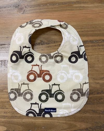 Neutral tractor baby bib